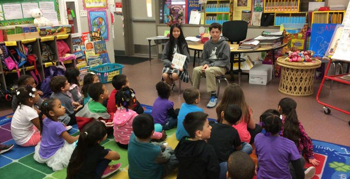 Young children reading to second graders